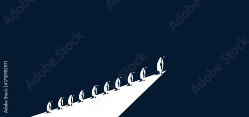 Group of penguins standing in line on triangular platform  
