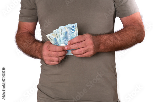 Goiânia, Brazil, September 17, 2025: Financial value of Brazilian real notes. Man holding money in cedula. Economy.