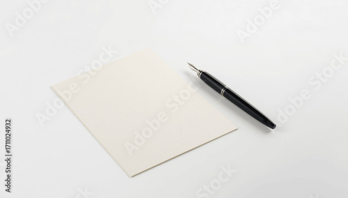 Pen and Blank Paper on a White Background