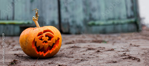 Pumpkin head glowing in the shadows