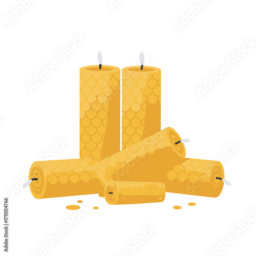 Yellow beeswax candles arranged on a white background  