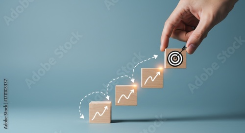 Achieving business goals with strategic planning and step-by-step growth, visualized on wooden blocks