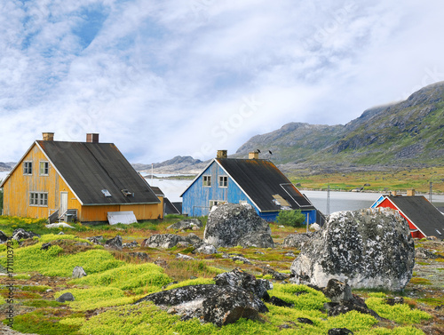 The Colorful Houses and Rugged Landscape of Nanortalik, Greenland on a Beautiful Summer Day