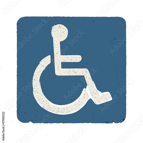 A blue handicap parking icon painted on asphalt symbolizes accessibility and inclusivity for disabled individuals, featuring a rustic disabled parking sign