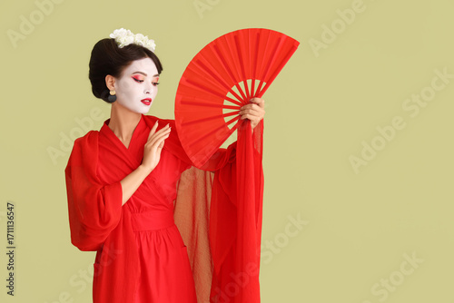 Beautiful young geisha with...