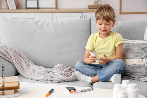 Little diabetic boy using l...