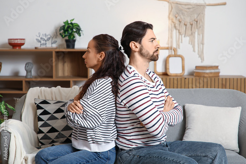 Unhappy couple sitting on s...