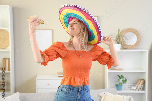 Young woman in sombrero hat...