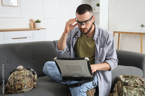 Young soldier working with ...