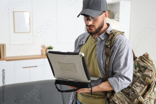 Young soldier working with ...