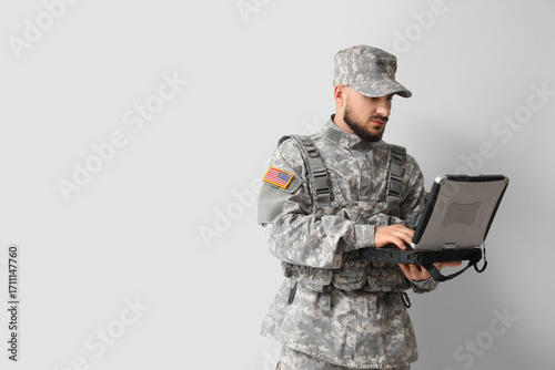 Soldier working with milita...
