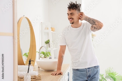 Young man with dreadlocks i...