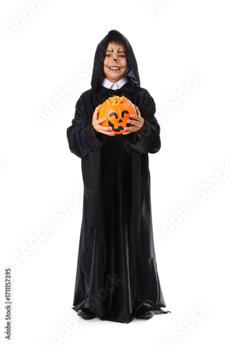 Young boy in grim reaper co...