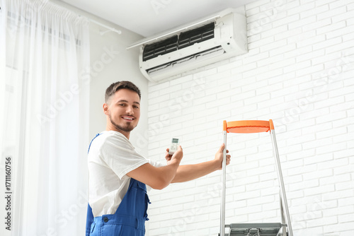 Male technician with remote...