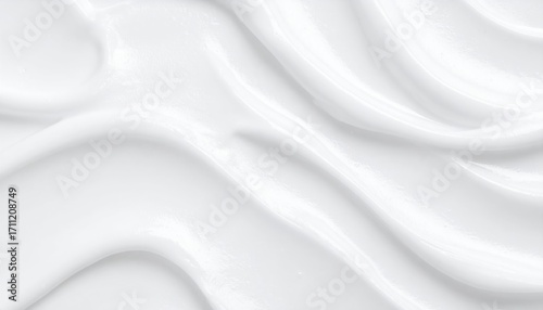 Smooth, flowing white cosmetic cream texture