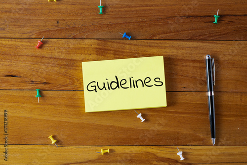 Word writing text Guidelines in a sticky note. Business concept.