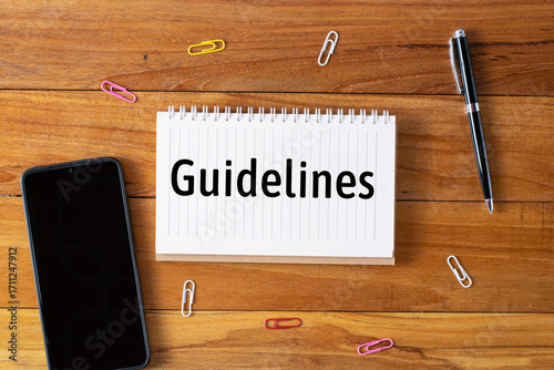 Guidelines written in a notebook on wooden desk