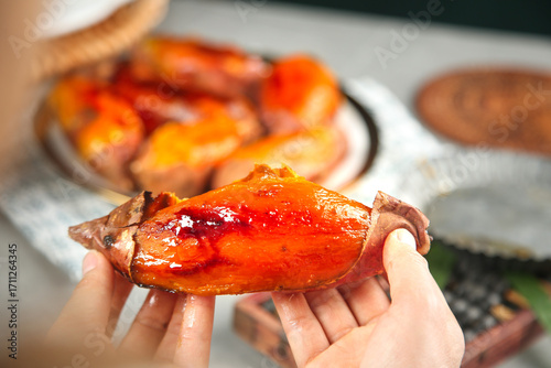 Roasted Sweet Potato Shandong Style - Traditional Chinese Baked Potato Snack in Hands