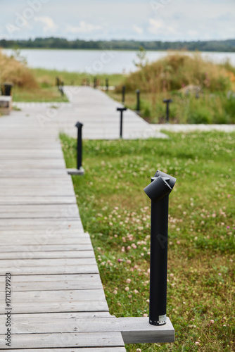 A beautiful and scenic pathway along the dock by the tranquil water offers a perfect escape