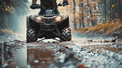 Riding four wheeler in muddy terrain