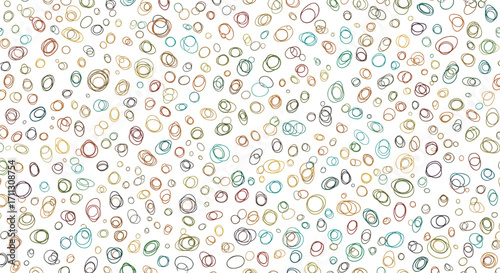 A diverse collection of small colorful irregular shapes scattered randomly across a white background.