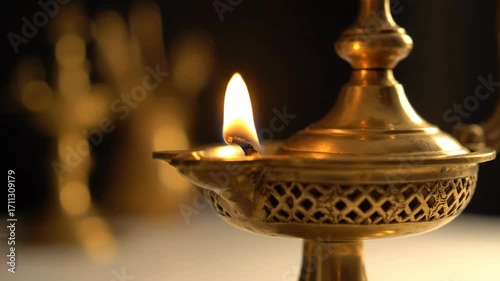 Elegant brass lamp with a flickering flame in a serene setting