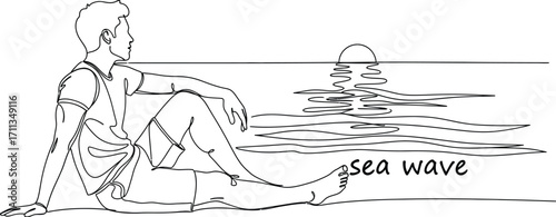 Man relaxing on beach watching sunset over calm sea