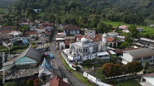 Aerial view of Mosque in the Middle of a Highland Village from Above