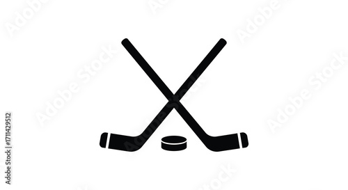 A simple black and white illustration of crossed hockey sticks and puck