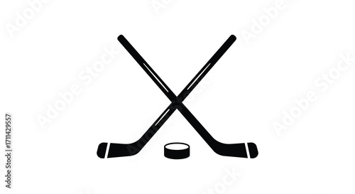 Two crossed hockey sticks and a puck on a white background