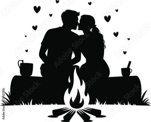 Romantic couple kissing by a glowing campfire silhouette