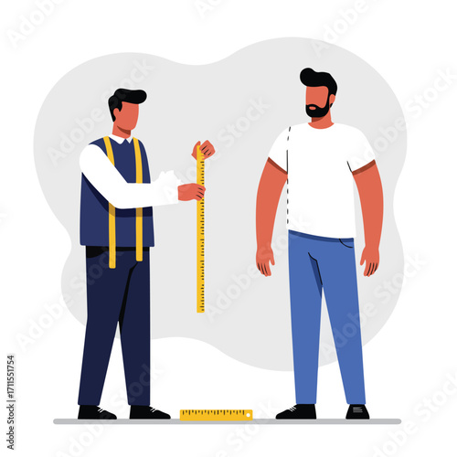 Man in overalls measures another man in a white shirt, using a yardstick on white backdrop