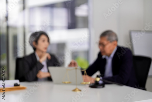 Legal professionals discuss justice scales office meeting adult Asian woman older man collaborate on important legal matters business advisory service