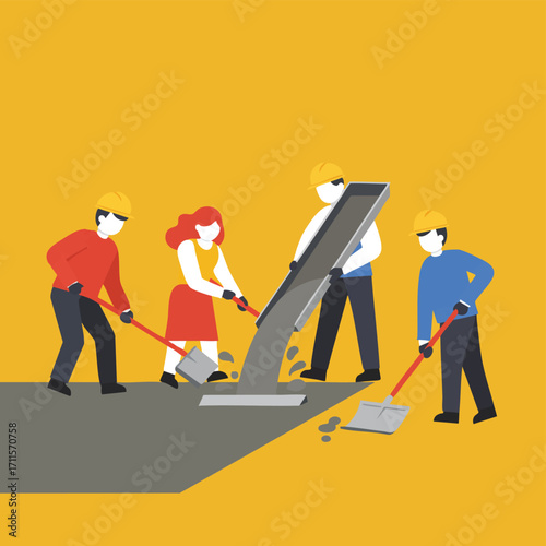 A team of construction workers wearing hard hats collaborates to pour and spread concrete on a building site, illustrating industrial development.