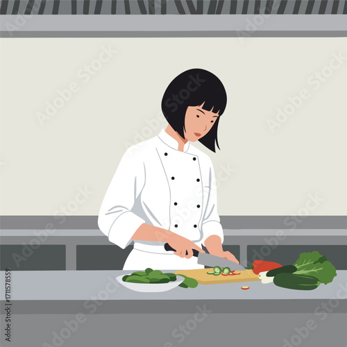 Female chef is cutting vegetables on a wooden cutting board in a commercial kitchen