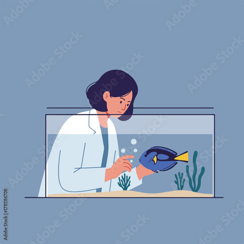 Scientist with a blue tang fish in a tank, surrounded by aquatic plants and bubbles