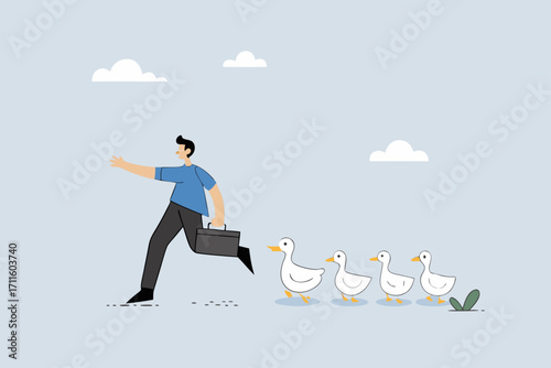 Being leader, businessman walks forward, followed by ducklings