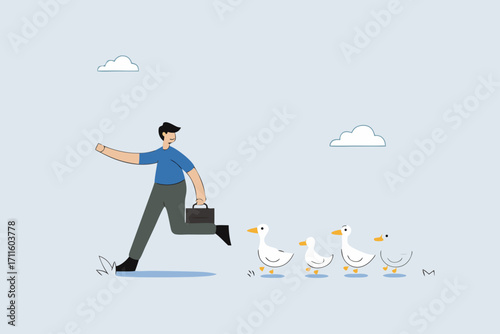 Being leader, businessman walks forward, followed by ducklings