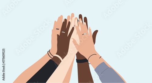 Diverse hands stacked in a high five symbolizing teamwork unity and collaboration.
