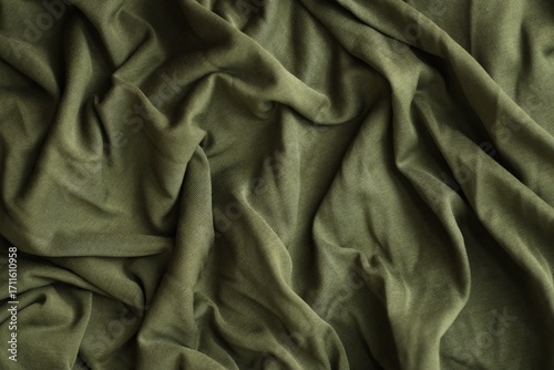 Background texture of camouflage khaki green color military uniform fabric