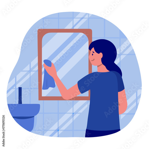 Woman wiping mirror with microfiber cloth in blue bathroom interior  