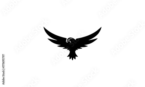 A majestic black eagle with outstretched wings in silhouette against a clean white background, symbolizing freedom and power