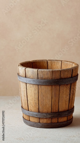 A rustic wooden pail evokes a vintage maple sap collection, reminiscent of quirky Wassailing traditions and harvest festivals