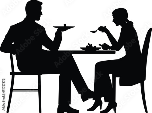 Couple dining together, romantic dinner, man and woman eating, intimate meal, enjoying food, sitting at table, restaurant setting, love, relationship, sharing meal, date night, cozy atmosphere.