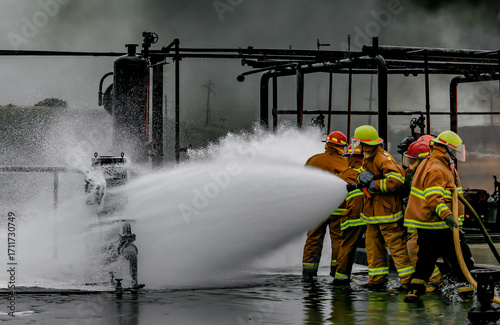 Firefighters practice in a refinery