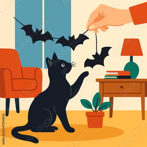 A playful black cat reaches for a dangling bat decoration, adding a charmingly spooky touch to a cozy indoor Halloween scene.