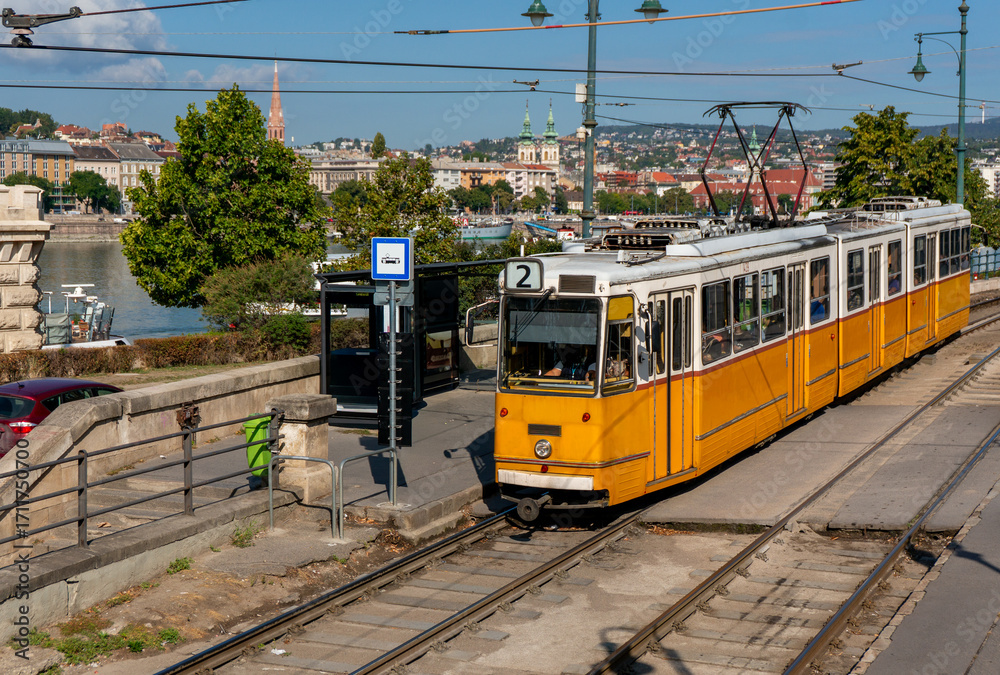 Fototapeta premium Old tram runs through the city of Budapest in Hungary