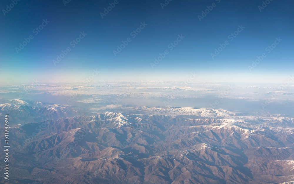 Fototapeta premium Plane Window View, Snow Mountains Aircraft Fly Landscape, Looking from Plane Cabin
