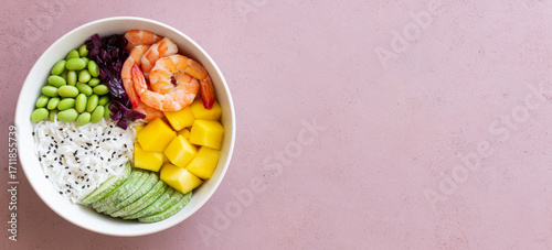 Hawaiian poke bowl with rice, shrimp, red cabbage, radish, edamame, and mango. Healthy eating. Diet.