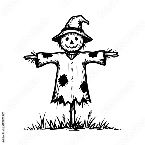 Scarecrow standing in the grass wearing a pointy hat for Halloween  